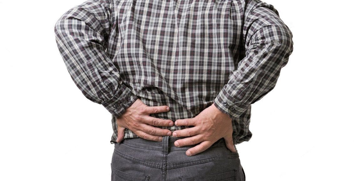 blog picture of man grabbing lower back in pain
