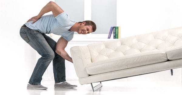 blog picture of man lifting couch with low back pain